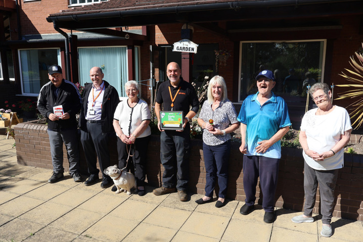 Residents of Albany House receiving the Community Bloom Award alongside Gentoo colleagues in recognition of their shared community garden.
