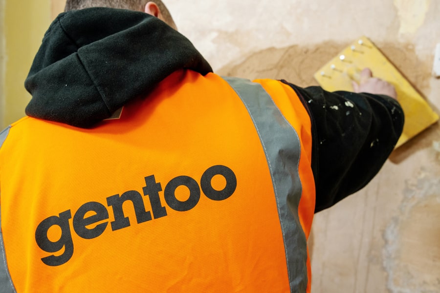 Gentoo tradesman plastering wall