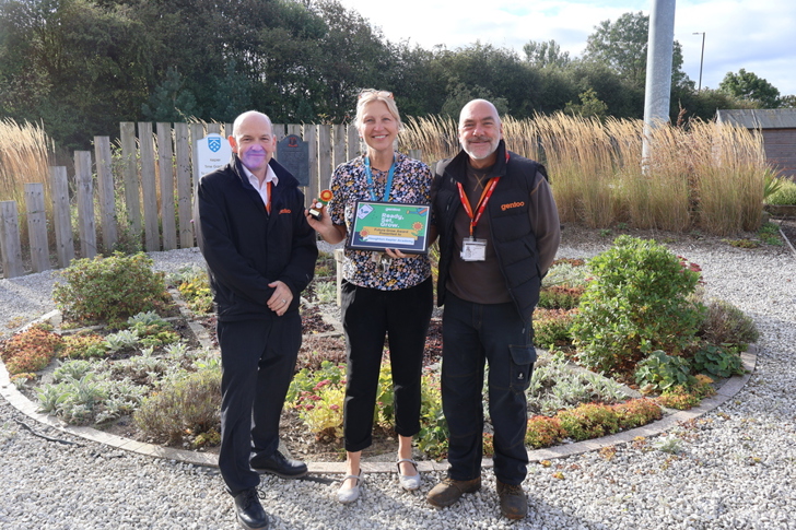 Representative from Houghton Kepier School receiving the 25 Years Forward: Future Grow Award alongside two Gentoo colleagues in the school’s outdoor learning garden.