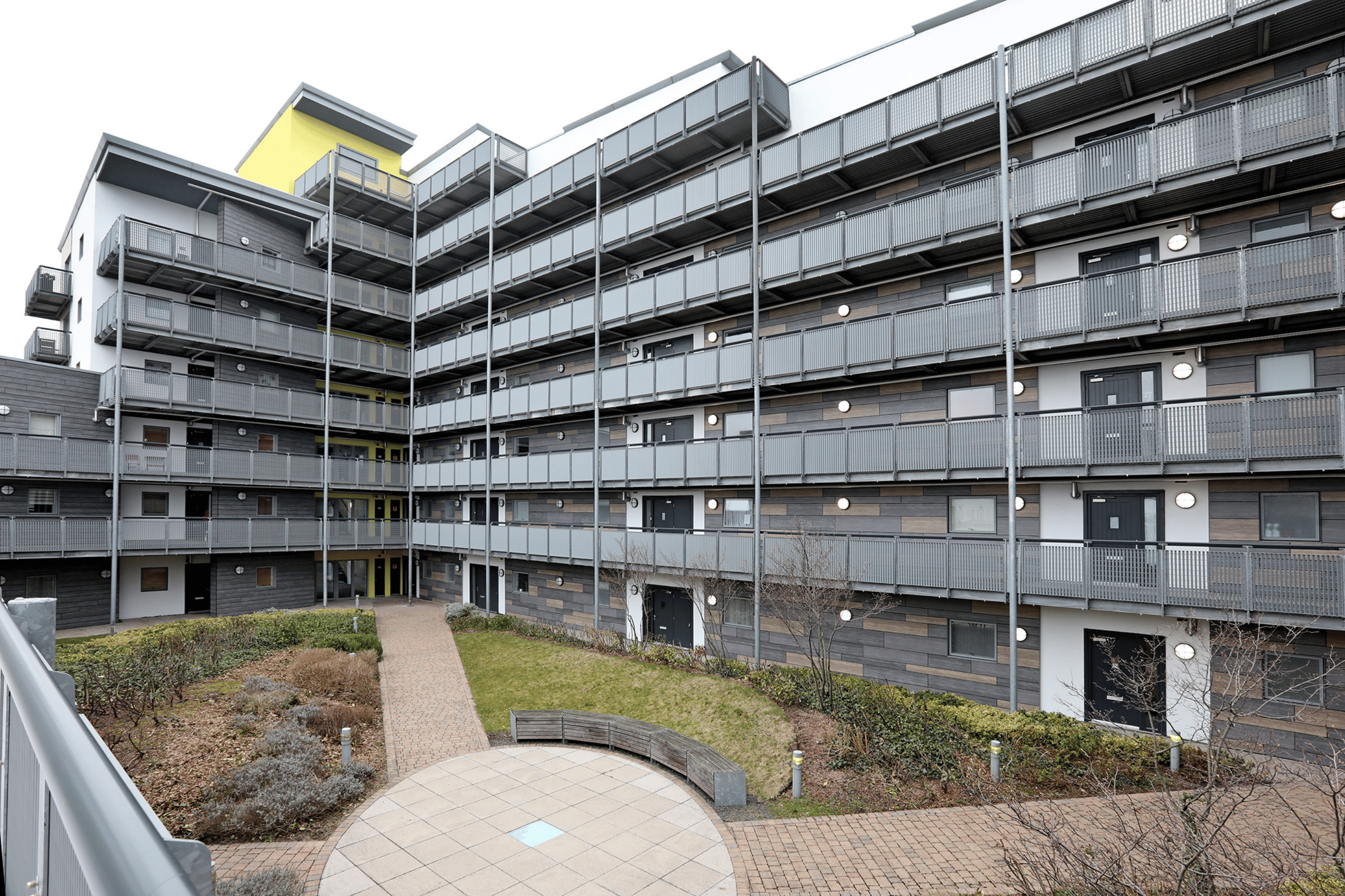 image of a block of flats and a communal garden