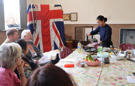 Gaganpreet hosting a community cooking class, demonstrating traditional Indian dishes funded through Gentoo's Community Grant programme.