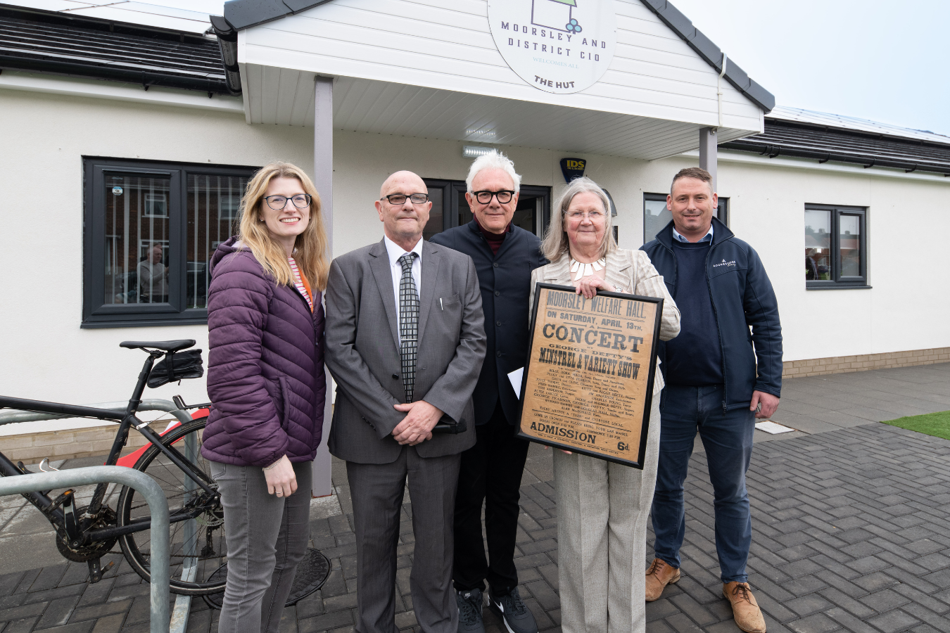 5 people standing in front of new community centre